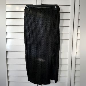 Mid length black skirt with side slit